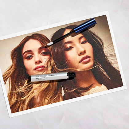 Two women with long hair on a product packaging featuring RevitaBrow Advanced.
