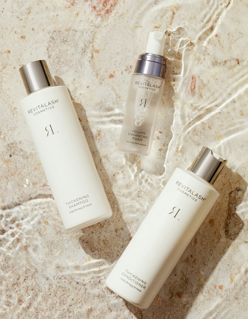 Volumizing hair collection on beach stone with water